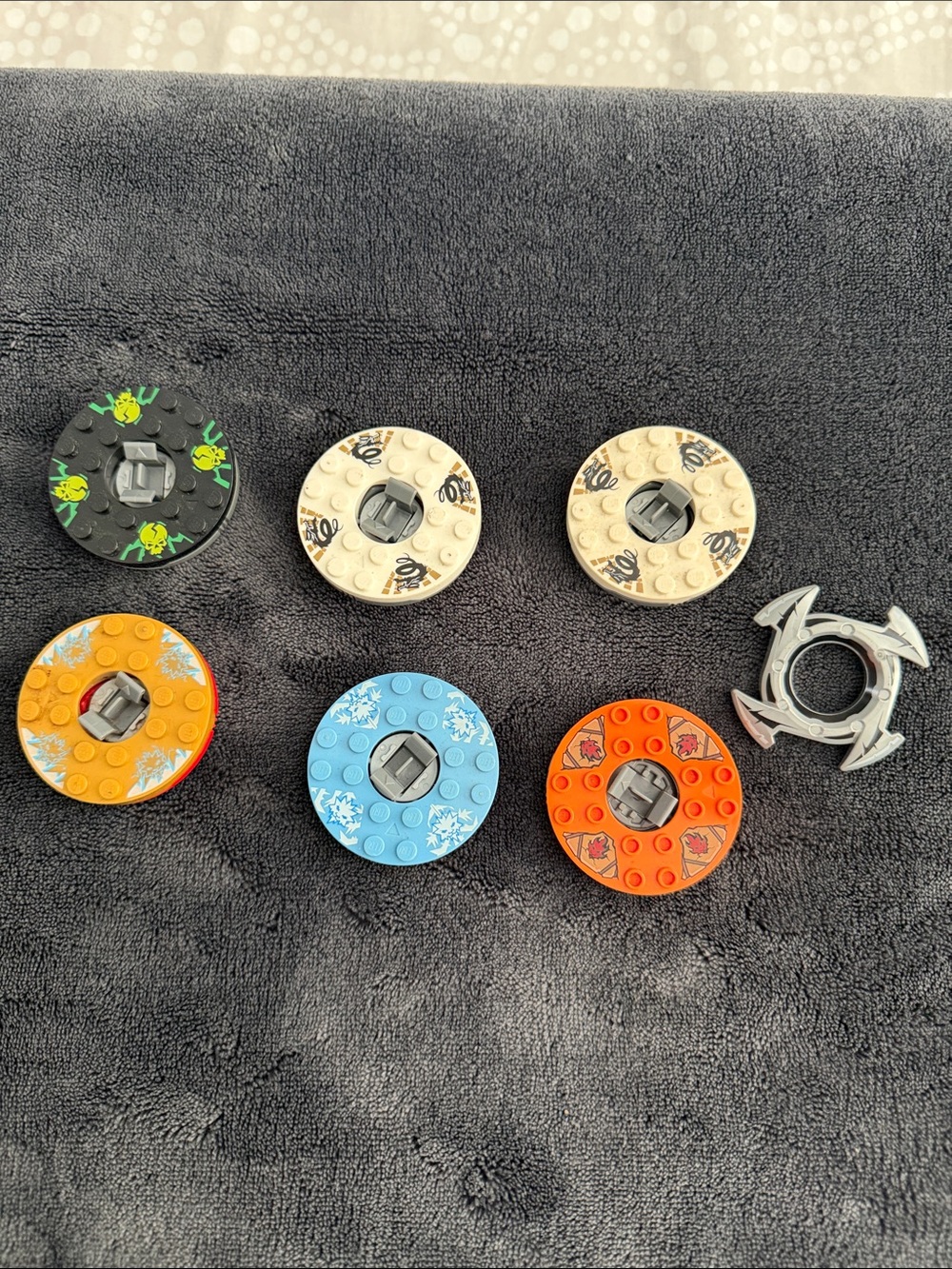Lego Ninjago set of 6 Spinning Disk in Black, Tan, Orange, Blue, Silver